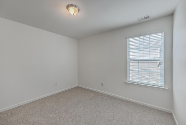 empty room featuring carpet flooring