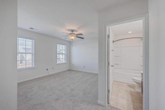 carpeted empty room with ceiling fan