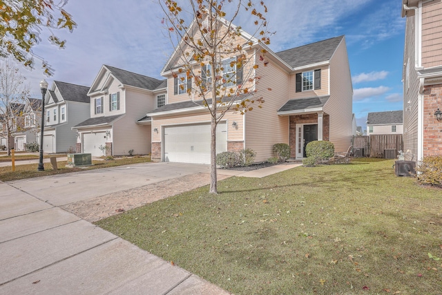 front facade with a garage, a front lawn, and central air condition unit