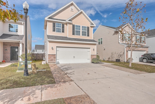 view of front of house featuring a front yard and a garage