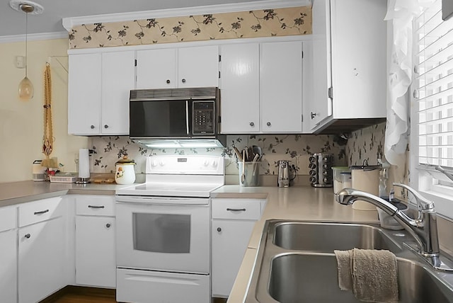 kitchen with white electric range oven, ornamental molding, white cabinetry, a sink, and black microwave