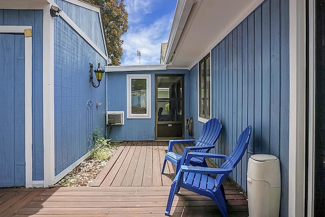 wooden deck with a wall mounted AC