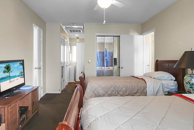 bedroom with ceiling fan and dark carpet