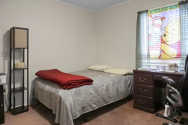 bedroom featuring ornamental molding and carpet