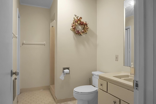 full bath with tile patterned floors, vanity, toilet, and baseboards