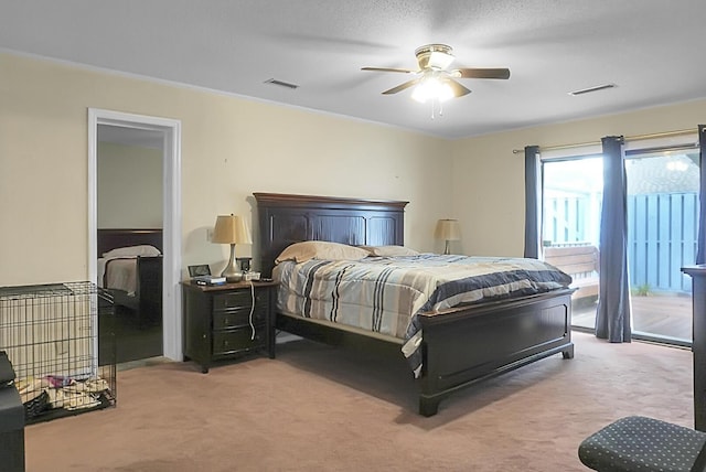 bedroom with access to exterior, ceiling fan, visible vents, and light colored carpet