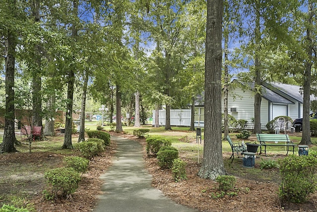 view of community featuring fence