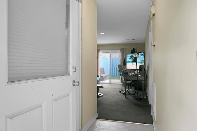 hallway with carpet flooring