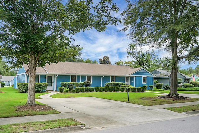 ranch-style house with a front lawn