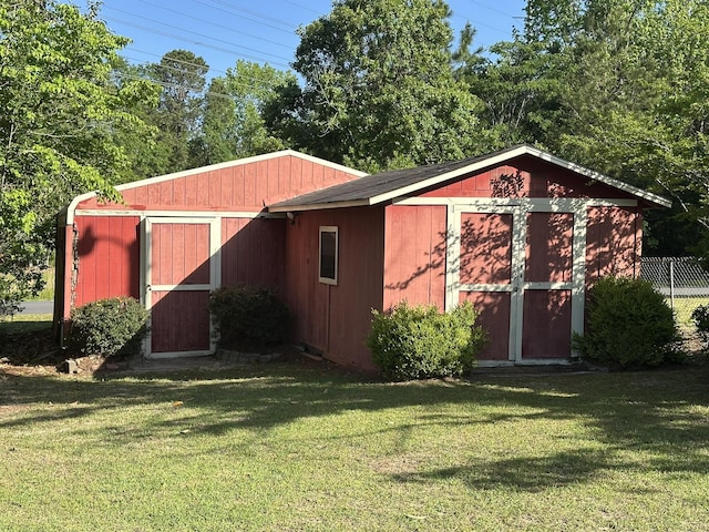 view of shed featuring fence