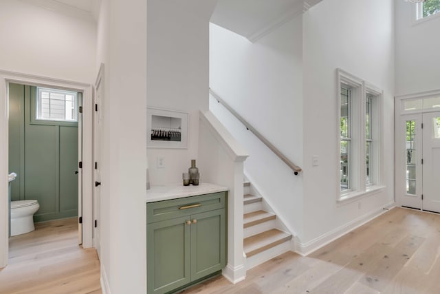 7053 Schooner St, Daniel Island, SC 29492 - entrance foyer with light wood-type flooring, healthy amount of natural light, stairway, and a high ceiling