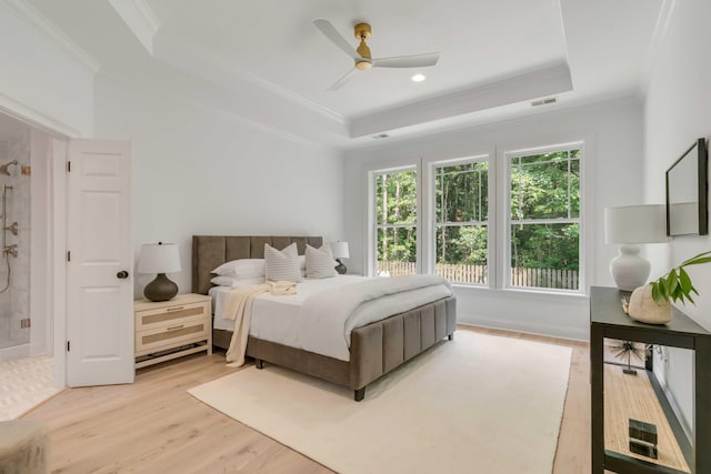 7053 Schooner St, Daniel Island, SC 29492 - bedroom featuring a tray ceiling, ornamental molding, light wood finished floors, a ceiling fan, and recessed lighting