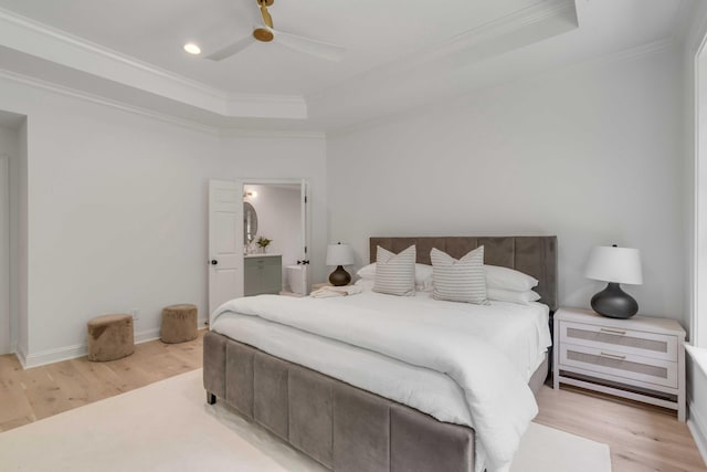 7053 Schooner St, Daniel Island, SC 29492 - bedroom featuring a tray ceiling, ornamental molding, light wood-style flooring, a ceiling fan, and baseboards