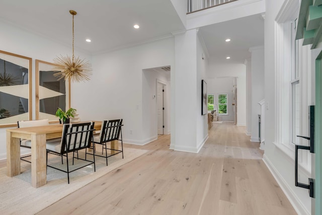 7053 Schooner St, Daniel Island, SC 29492 - dining space with ornamental molding, light wood finished floors, baseboards, recessed lighting, and a chandelier