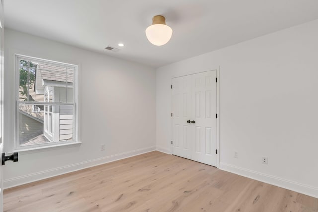 7053 Schooner St, Daniel Island, SC 29492 - unfurnished bedroom featuring light wood-style floors, baseboards, recessed lighting, and a closet