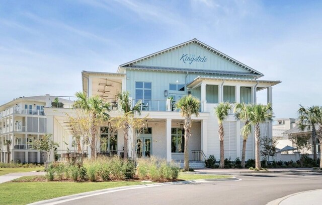 7053 Schooner St, Daniel Island, SC 29492 - view of front facade featuring a balcony, board and batten siding, and covered porch