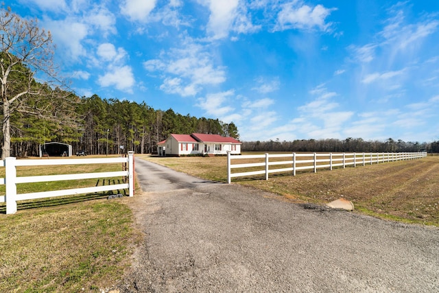 view of road featuring a rural view and driveway