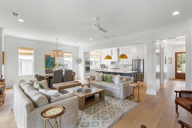 3023 Eventide Dr, Johns Island, SC 29455 - living area with ceiling fan, light wood-type flooring, recessed lighting, and a chandelier