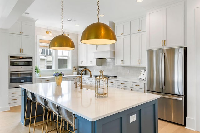 3023 Eventide Dr, Johns Island, SC 29455 - kitchen with appliances with stainless steel finishes, custom range hood, decorative backsplash, a sink, and light countertops