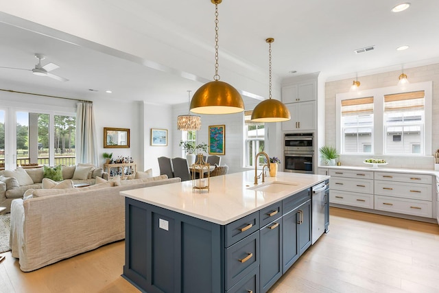 3023 Eventide Dr, Johns Island, SC 29455 - kitchen with a sink, stainless steel appliances, ceiling fan, light wood-type flooring, and open floor plan