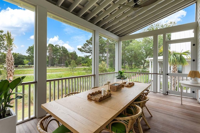 3023 Eventide Dr, Johns Island, SC 29455 - sunroom featuring outdoor dining space, vaulted ceiling, a ceiling fan, and view of scattered trees