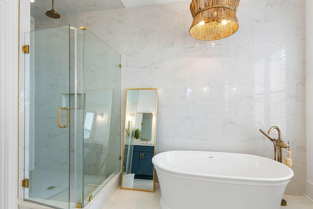 3023 Eventide Dr, Johns Island, SC 29455 - full bathroom with a marble finish shower, a soaking tub, vanity, marble finish floors, and tile walls