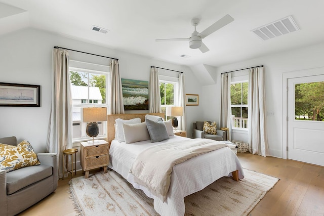 3023 Eventide Dr, Johns Island, SC 29455 - bedroom with multiple windows, light wood finished floors, and a ceiling fan