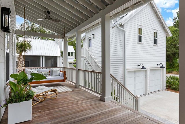 3023 Eventide Dr, Johns Island, SC 29455 - wooden deck with stairway, a garage, ceiling fan, and concrete driveway