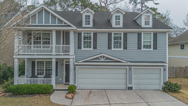 view of front of house with a garage and covered porch