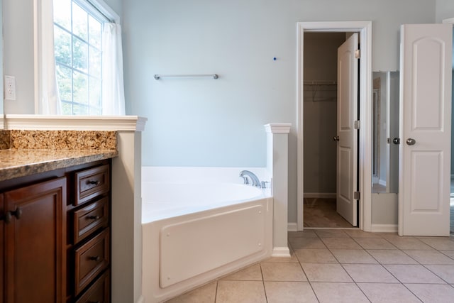 7217 Mossy Creek Ln, Hanahan, SC 29410 - bathroom featuring a garden tub, tile patterned floors, vanity, and baseboards