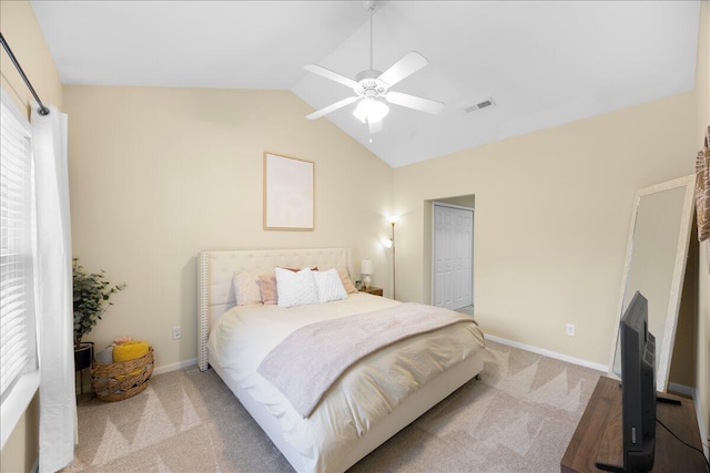 bedroom featuring visible vents, ceiling fan, baseboards, lofted ceiling, and carpet floors