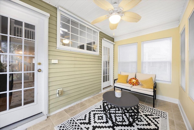 sunroom / solarium with ceiling fan