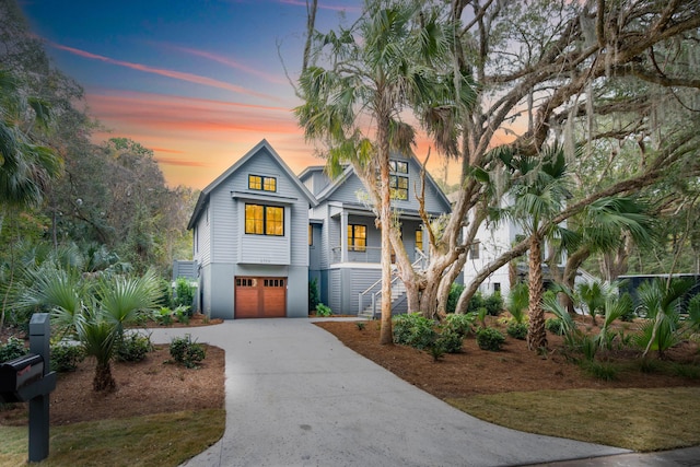 view of front of home with a porch and a garage