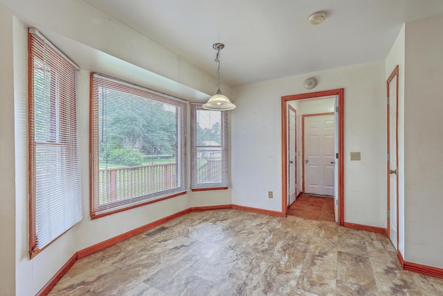 1023 Striper Ave, Moncks Corner, SC 29461 - unfurnished dining area featuring baseboards and stone finish flooring