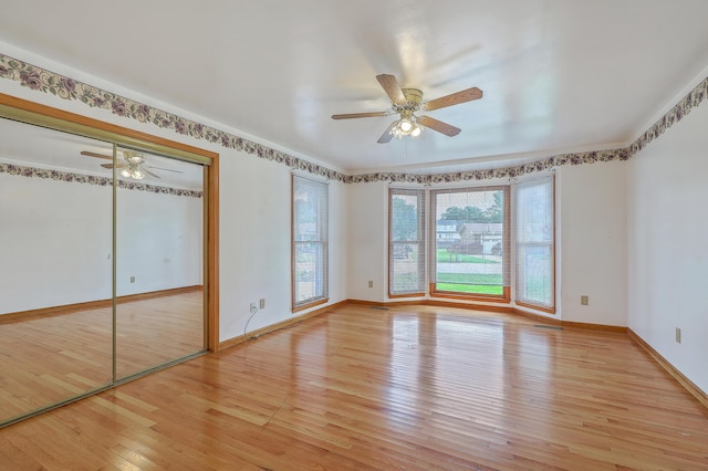 1023 Striper Ave, Moncks Corner, SC 29461 - unfurnished bedroom with light wood-type flooring, baseboards, a ceiling fan, and ornamental molding