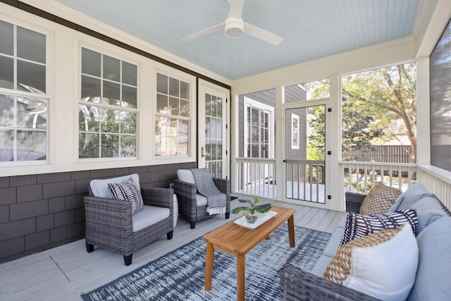 sunroom with a ceiling fan