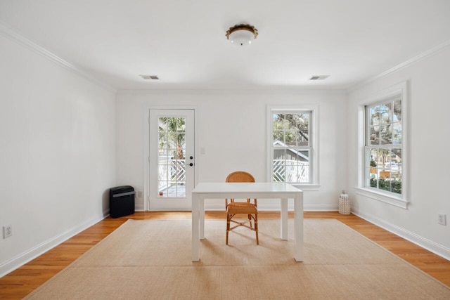 office featuring plenty of natural light, visible vents, and light wood-type flooring