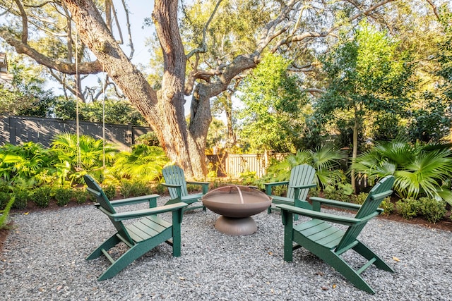 surrounding community with a patio, a fire pit, and a fenced backyard