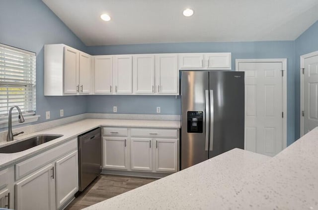 426 Colony Dr, Ridgeland, SC 29936 - kitchen with sink, white cabinets, vaulted ceiling, and appliances with stainless steel finishes