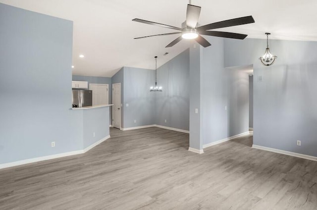 426 Colony Dr, Ridgeland, SC 29936 - unfurnished living room with lofted ceiling, ceiling fan with notable chandelier, and hardwood / wood-style flooring