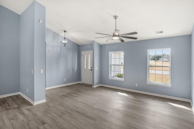 426 Colony Dr, Ridgeland, SC 29936 - unfurnished room with ceiling fan with notable chandelier and wood-type flooring