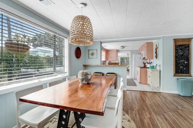 dining area with light wood-type flooring