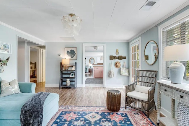 interior space featuring crown molding and hardwood / wood-style floors