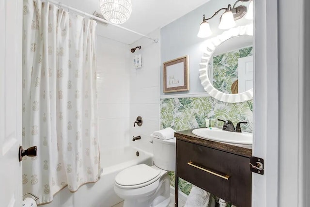 full bathroom featuring shower / bath combo, toilet, vanity, and tasteful backsplash