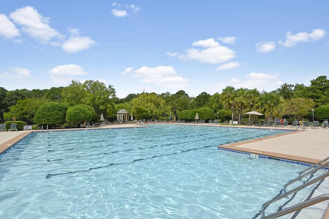 community pool with a patio area