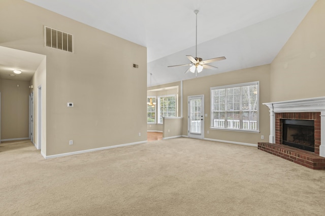 unfurnished living room featuring high vaulted ceiling, light colored carpet, visible vents, and a fireplace