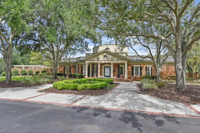 greek revival house with brick siding