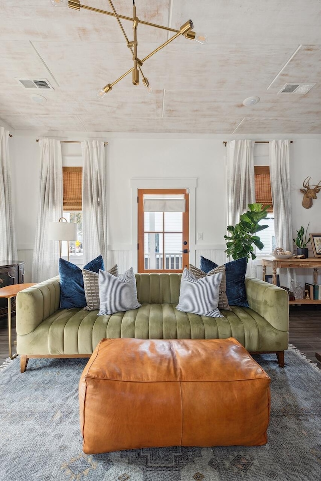 living area with wainscoting and plenty of natural light