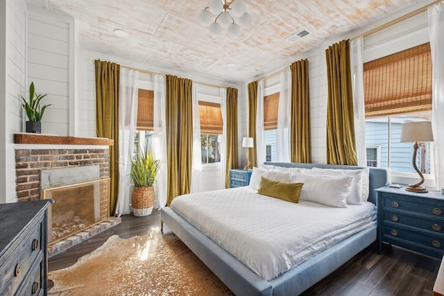 bedroom with dark wood-style flooring