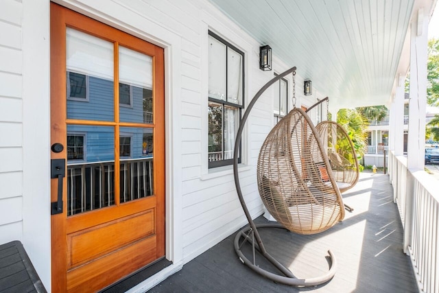 view of exterior entry featuring a porch